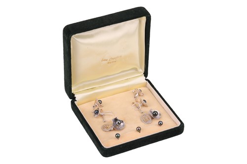 Lot 227 - A Chinese cased black cultured pearl dress set,...