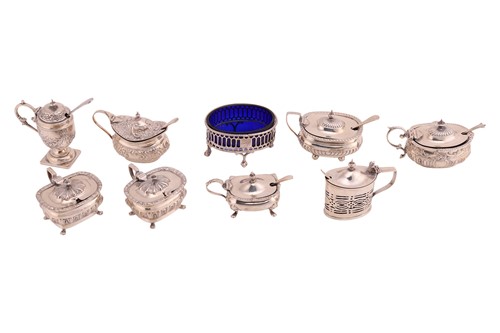 Lot 423 - A collection of nine assorted silver mustard...