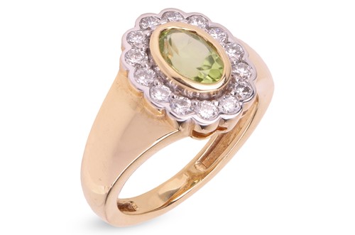 Lot 325 - A peridot and synthetic diamond pinky ring,...