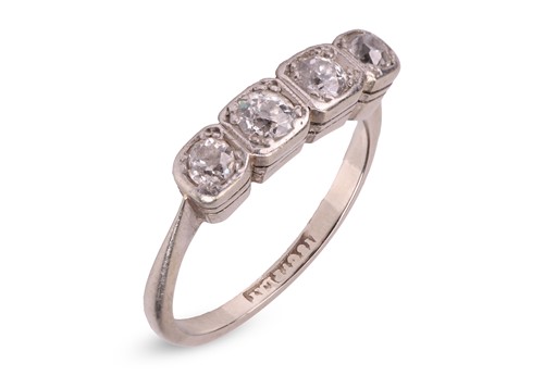 Lot 200 - A four-stone diamond-set ring, composed of...