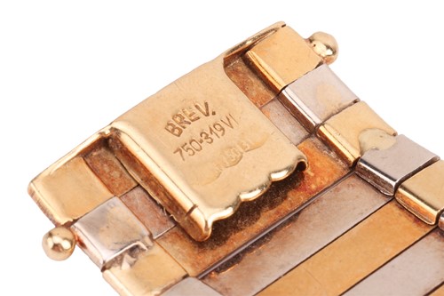 Lot 35 - A two-tone omega chain bracelet with a pair of...