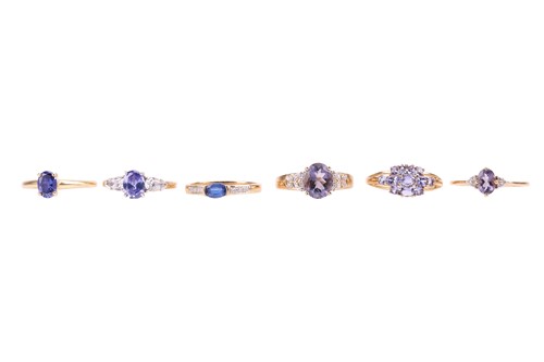 Lot 14 - Six gold rings set with purple gemstones; to...