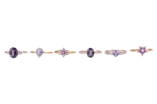 Lot 1 - Six rings in 9ct gold set with purple...