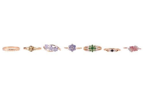 Lot 23 - Six gem-set rings and a plain band all set in...