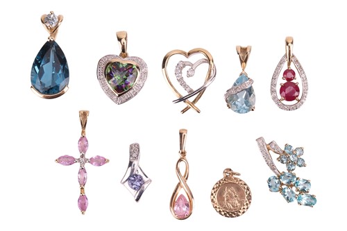 Lot 13 - A collection of ten pendants; mostly set with...
