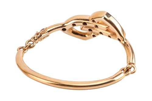 Lot 66 - A diamond-set articulated bangle, featuring a...
