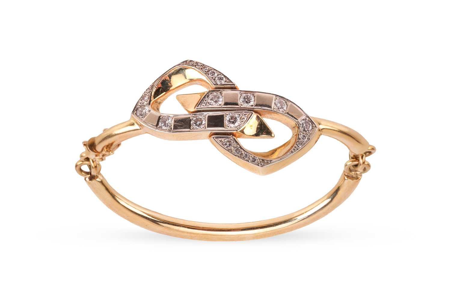 Lot 66 - A diamond-set articulated bangle, featuring a...