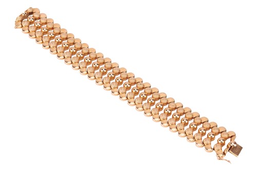 Lot A wide articulated bracelet, comprising a...
