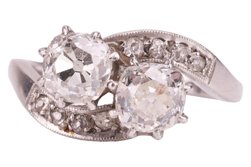Lot A diamond-set crossover ring, claw-set with...