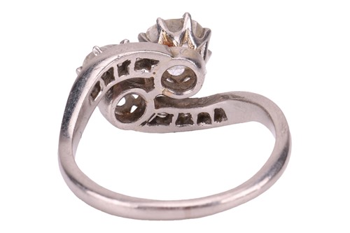 Lot A diamond-set crossover ring, claw-set with...