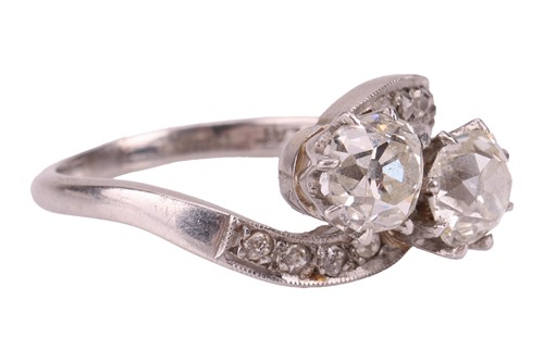 Lot A diamond-set crossover ring, claw-set with...