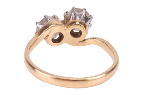 Lot A diamond-set crossover ring, claw-set with...