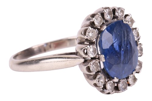 Lot A sapphire and diamond cluster ring, centred...