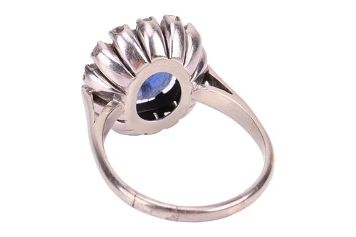 Lot A sapphire and diamond cluster ring, centred...