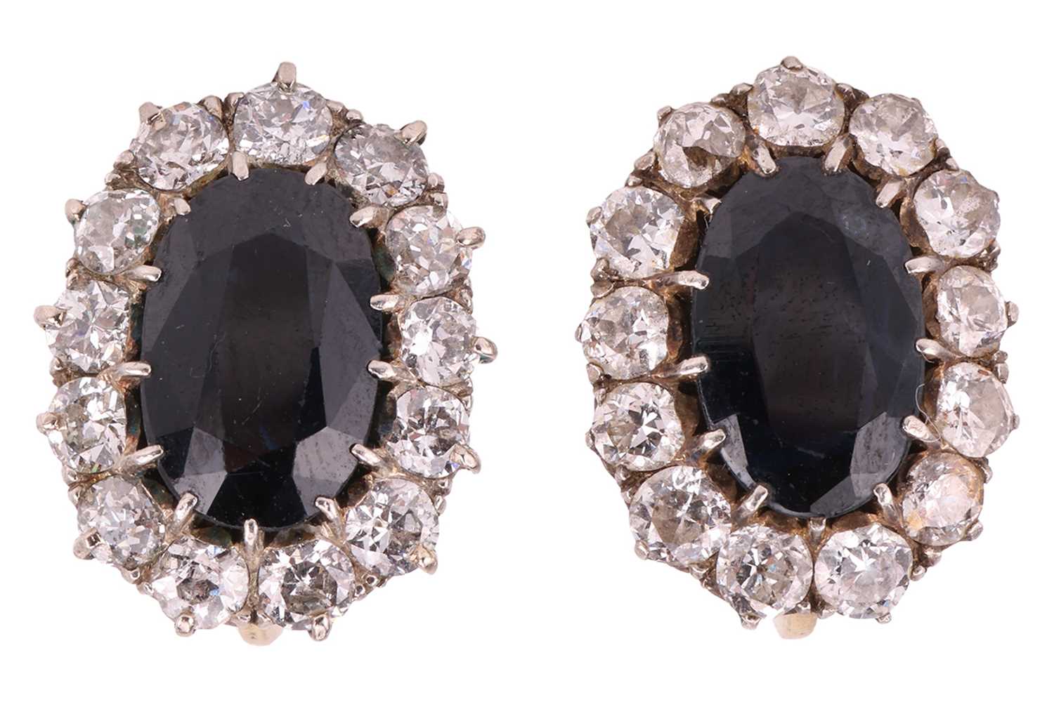 Lot 205 - A pair of sapphire and diamond cluster...