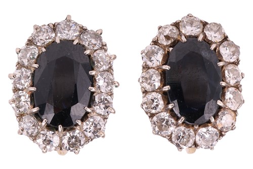 Lot 205 - A pair of sapphire and diamond cluster...