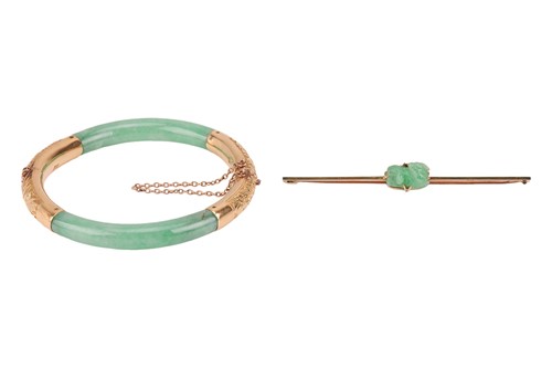 Lot 221 - A Chinese jade hinged bangle and a carved jade...
