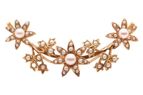 Lot 334 - An Edwardian floral brooch set with split...