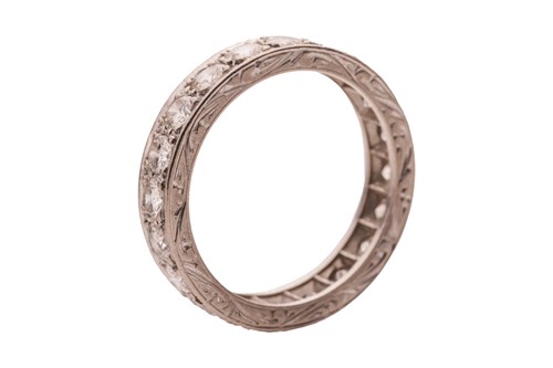 Lot 59 - A diamond eternity ring, grain-set with twenty...
