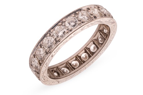 Lot 59 - A diamond eternity ring, grain-set with twenty...