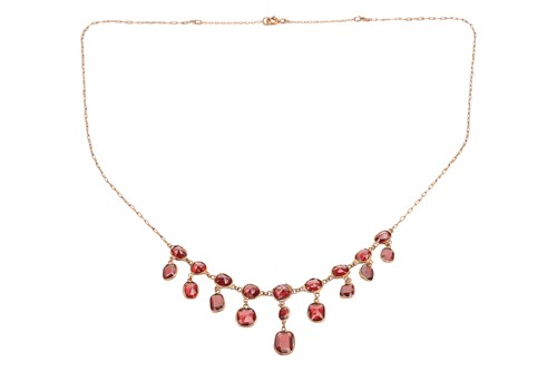 Lot 186 - A garnet-set fringe necklace, the mixed-cut...