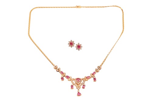 Lot 277 - A ruby and diamond-set necklace, of floral and...
