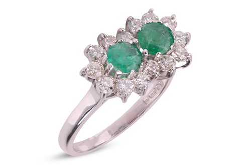 Lot 33 - An emerald and diamond-set cluster ring, set...