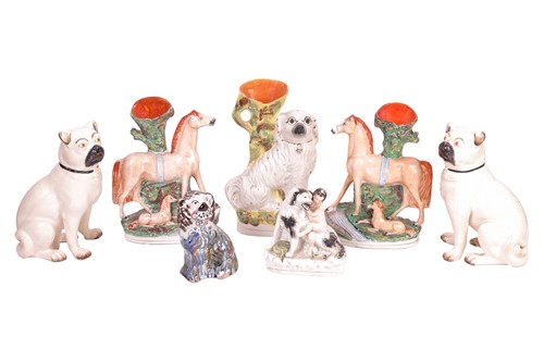 Lot 240 - A collection of seven Staffordshire figures,...