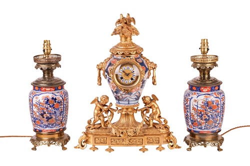 Lot A 19th century French gilt metal mantel clock...