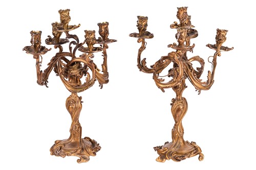 Lot 207 - A pair of Louis XV style ormolu five-light...