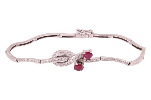 Lot 261 - A ruby and diamond-set bracelet, claw-set with...