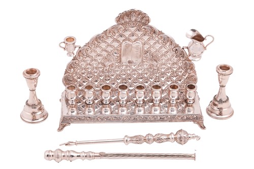 Lot 458 - A sterling silver Hanukkah menorah, decorated...
