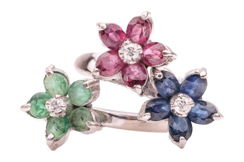 Lot 249 - A floral gem-set crossover ring, featuring...