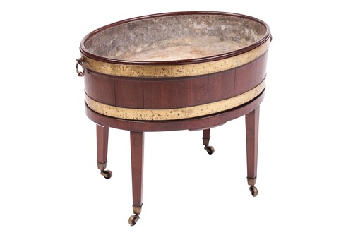 Lot A George III mahogany oval wine cooler, with...
