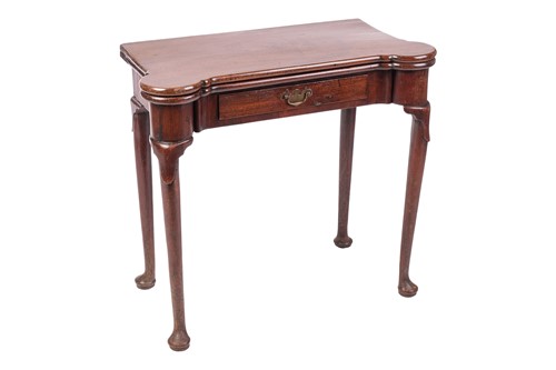 Lot A George III red walnut fold-over gaming table...