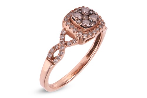 Lot 228 - A diamond-set ring, comprising a central...