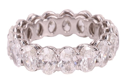 Lot 124 - A diamond full eternity ring, claw-set with...