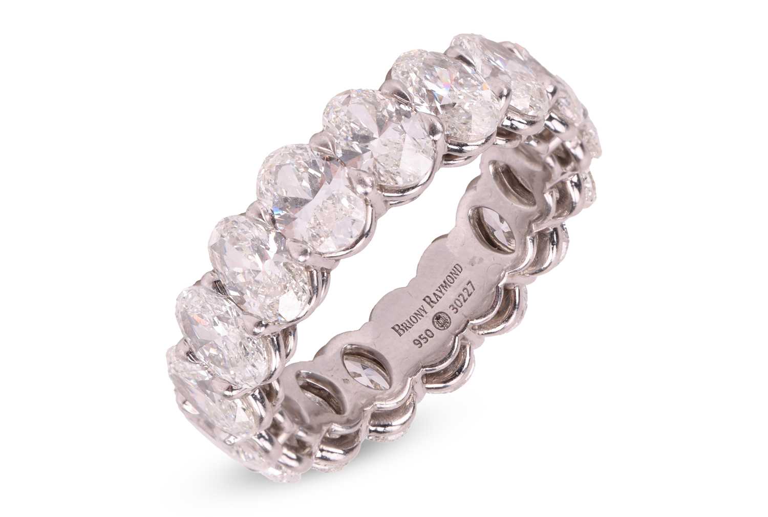 Lot 124 - A diamond full eternity ring, claw-set with...