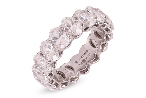 Lot 124 - A diamond full eternity ring, claw-set with...