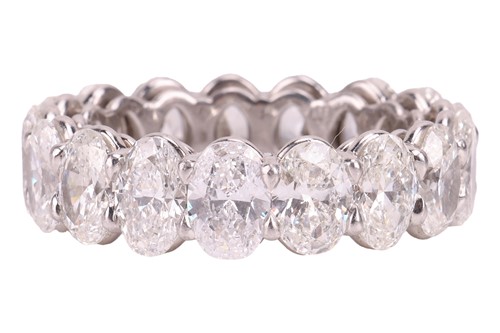 Lot 124 - A diamond full eternity ring, claw-set with...