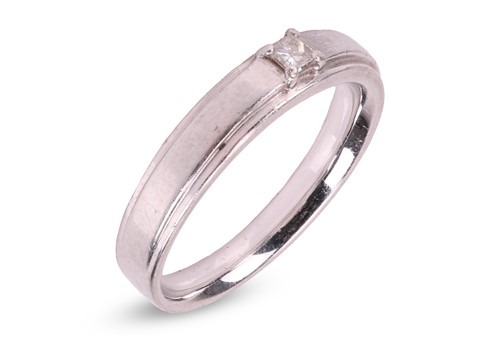 Lot 59 - A diamond-set ring, featuring a central...