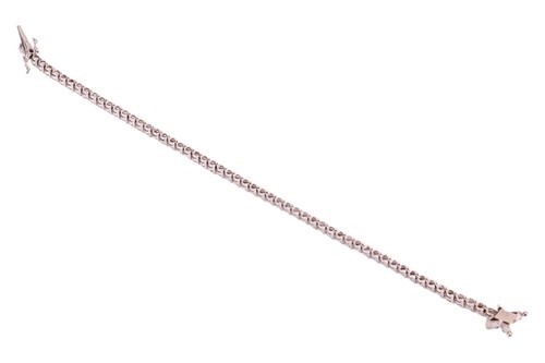 Lot 128 - A diamond-set line bracelet, claw-set with...