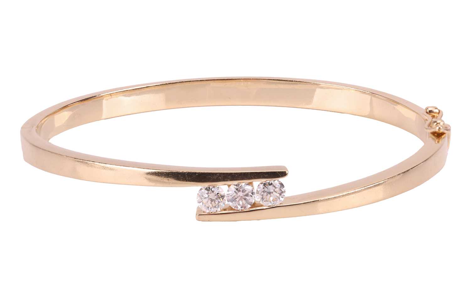 Lot 74 - A diamond-set hinged bangle, of crossover...