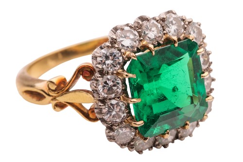 Lot 82 - A Colombian emerald and diamond cluster ring,...
