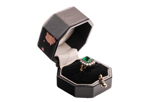 Lot 82 - A Colombian emerald and diamond cluster ring,...