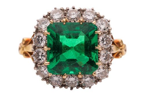 Lot 82 - A Colombian emerald and diamond cluster ring,...