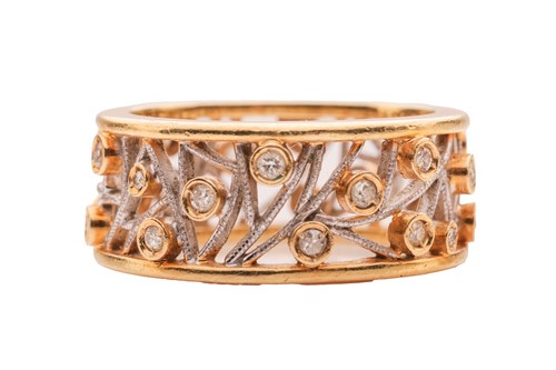 Lot 31 - A diamond-set band ring, of foliate openwork...