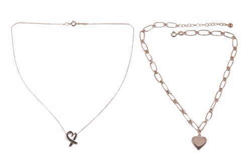 Lot 77 - A Tiffany & Co. loving heart necklace by...