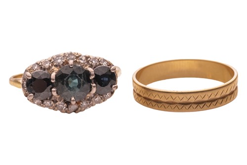 Lot 56 - A wedding band and a half-hoop ring; The...