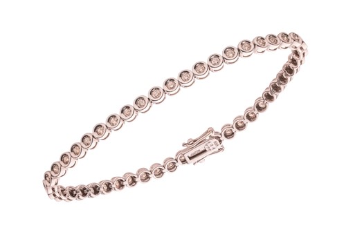 Lot 257 - A diamond-set line bracelet, composed of forty-...